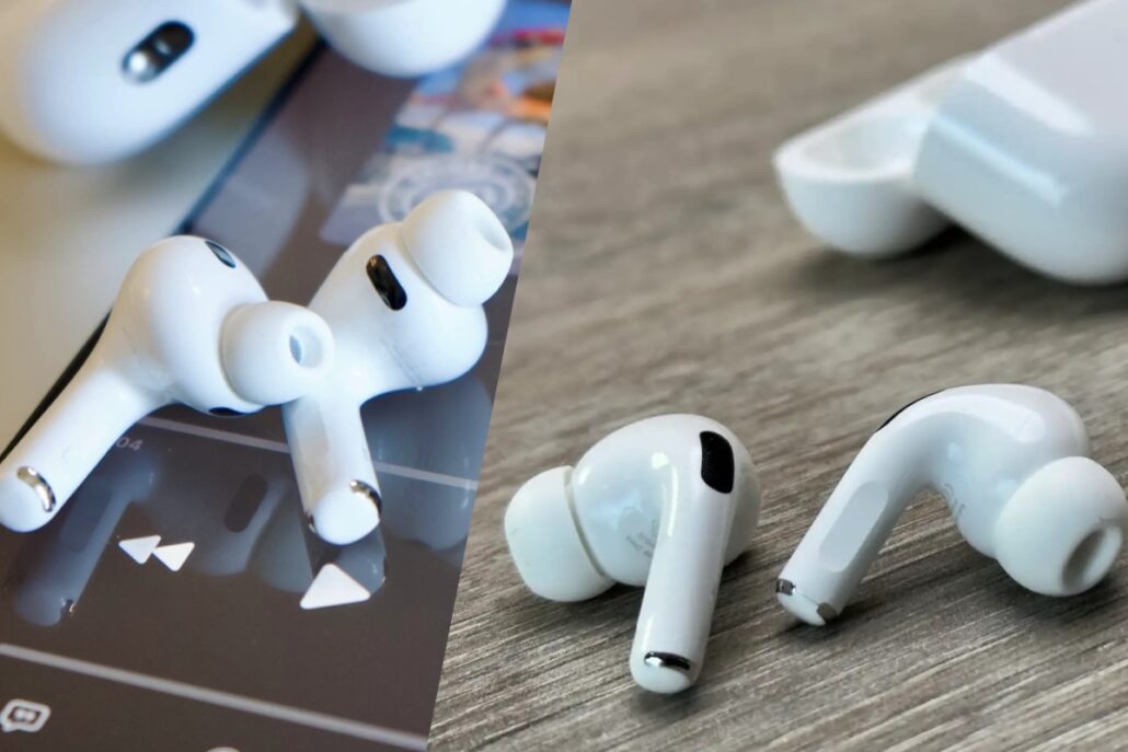 White wireless earbuds with a charging case, shown split across a wooden surface and a device screen, with one earbud detached on the right side.
