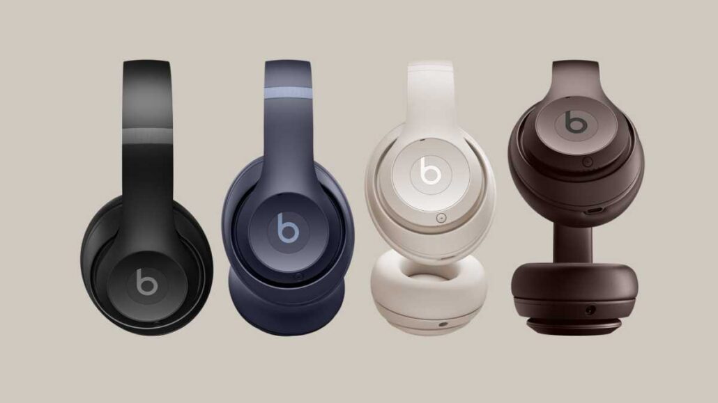 Four over-ear Beats headphones in black, navy, white, and brown, lined up side by side, showing color variants.