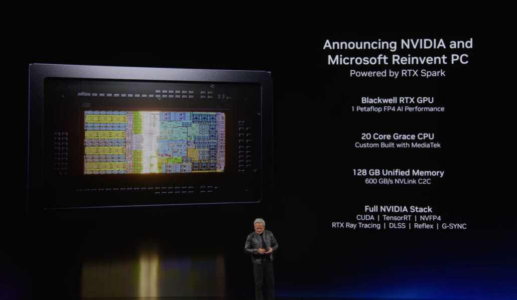 Presenter on stage beside a slide that shows a semiconductor image on the left and a list of NVIDIA–Microsoft Reinvent PC specs on the right (RTX Spark, Blackwell RTX GPU, 20-core Grace CPU, 128 GB memory, full NVIDIA stack).