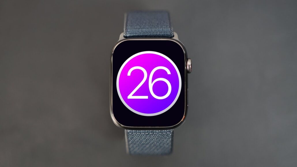 Smartwatch with a purple circular 26 badge on its screen and a blue fabric band behind it.