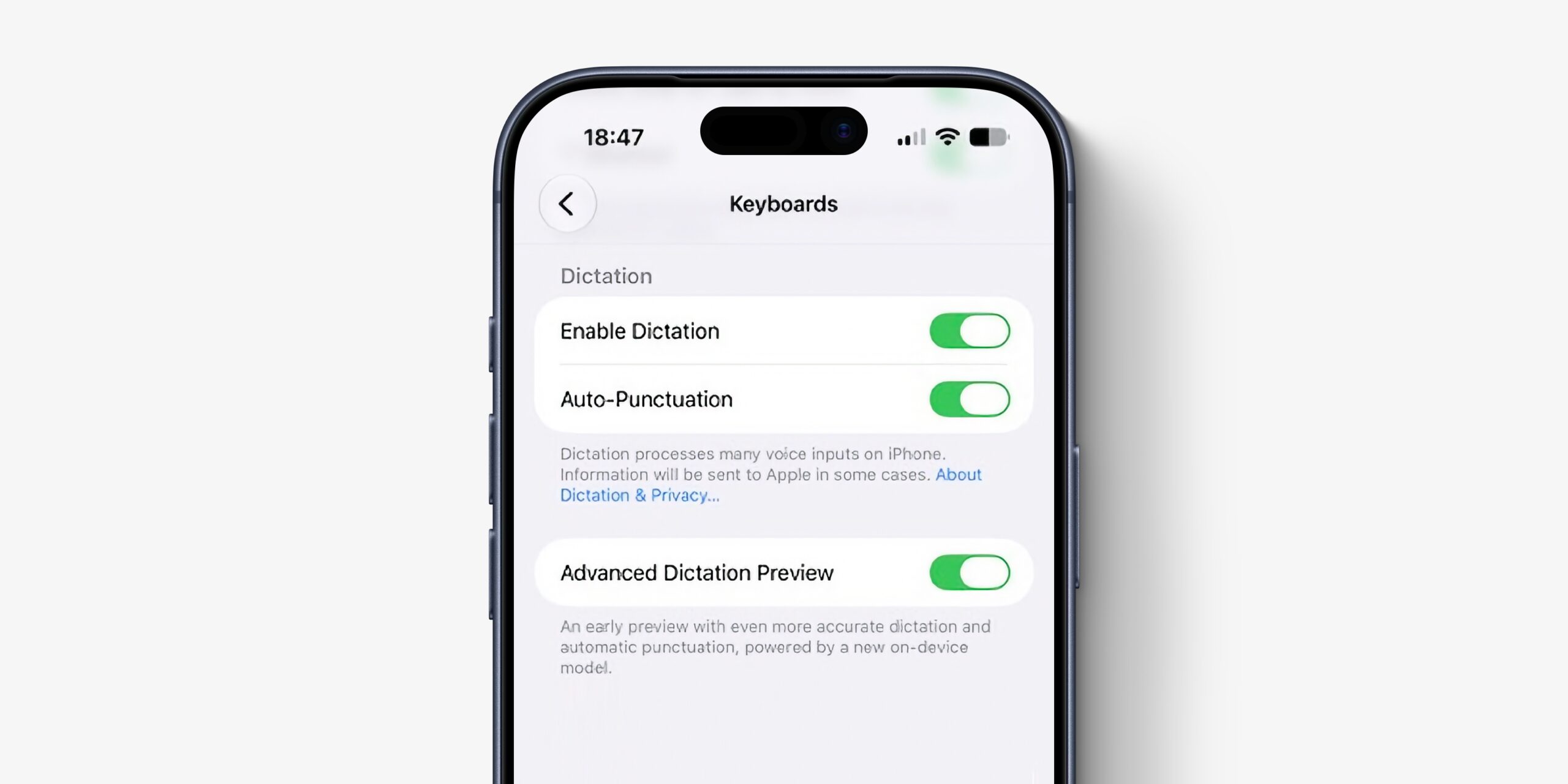 iPhone settings screen labeled Keyboards showing Dictation options with Enable Dictation and Auto-Punctuation toggles on.